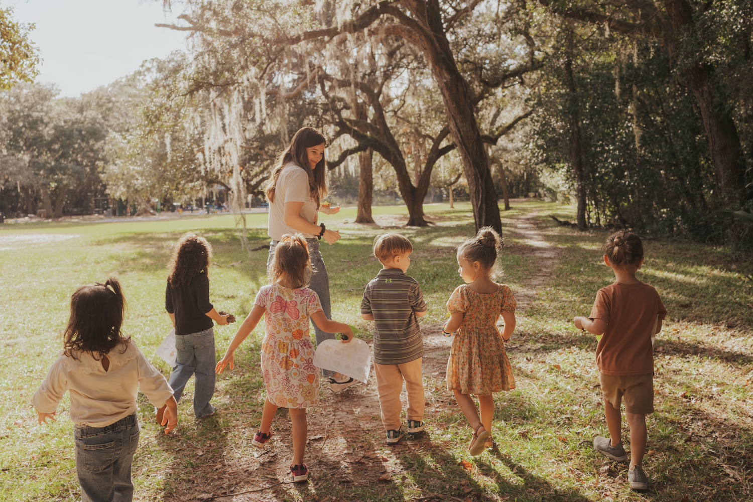 Katie Gonzales outside with several of her patients
